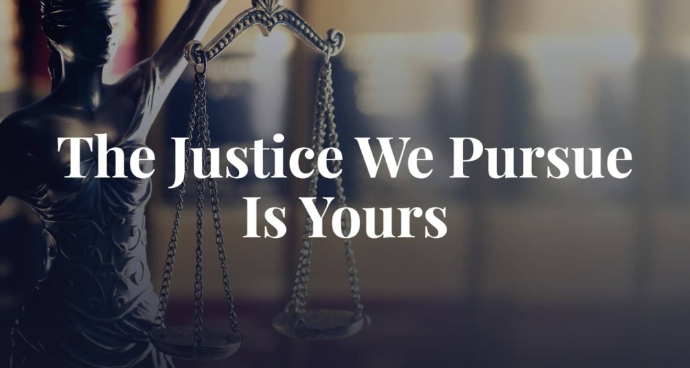 lady justice holding a balance beam with the caption "the justice we pursue is yours"