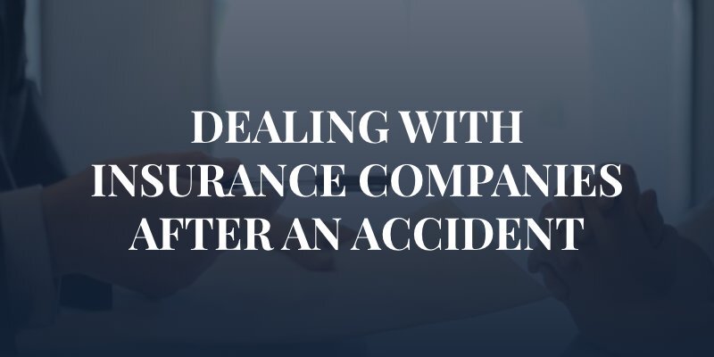 man handing insurance paper with a pen to woman with the caption "dealing with insurance companies after an accident"